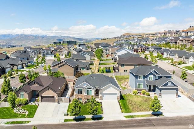 aerial perspective of suburban area featuring a mountainous background