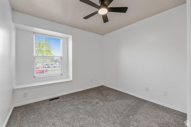 1888 W 1520 N, Clinton, UT 84015 - spare room with dark carpet, a ceiling fan, and baseboards