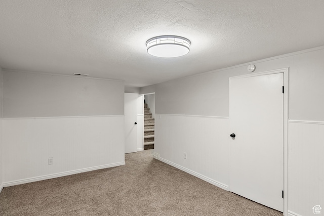 5857 S 2625 W, Roy, UT 84067 - unfurnished room featuring a textured ceiling, stairs, wainscoting, and carpet floors