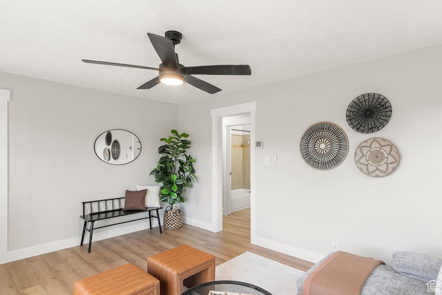 5857 S 2625 W, Roy, UT 84067 - living room featuring light wood-style floors, a ceiling fan, and baseboards