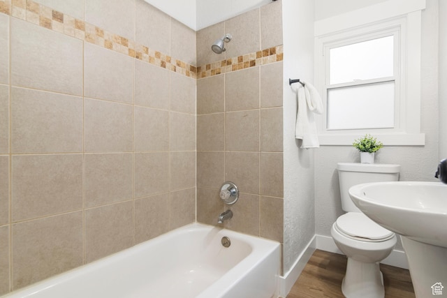 5857 S 2625 W, Roy, UT 84067 - full bath with toilet, wood finished floors, shower / washtub combination, and baseboards