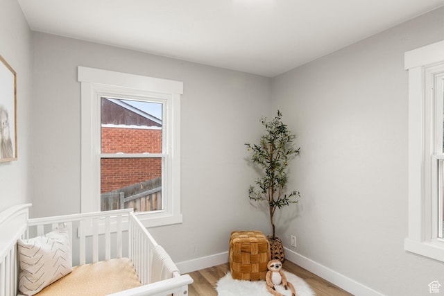5857 S 2625 W, Roy, UT 84067 - bedroom with light wood finished floors, baseboards, and a nursery area