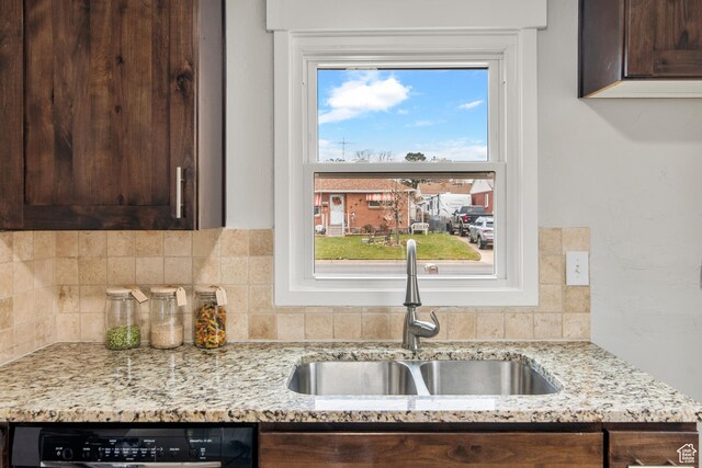 5857 S 2625 W, Roy, UT 84067 - kitchen featuring a sink, dark brown cabinets, dishwashing machine, and tasteful backsplash