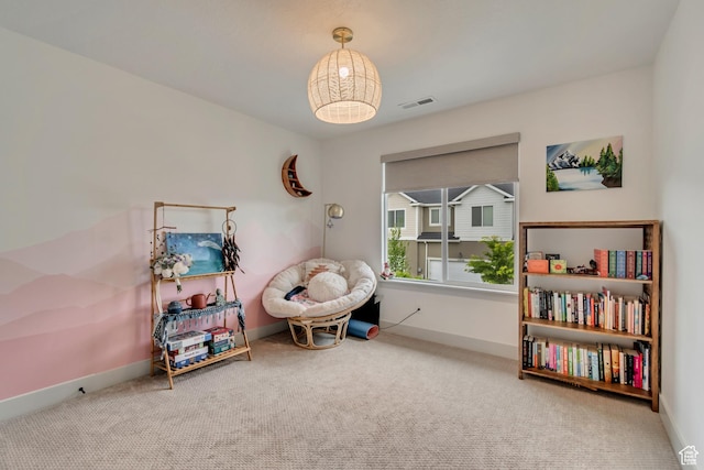 playroom with carpet floors and baseboards