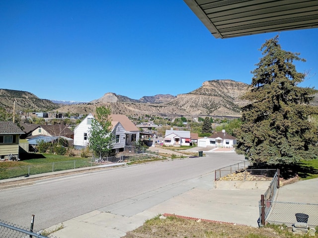 view of mountain backdrop with nearby suburban area