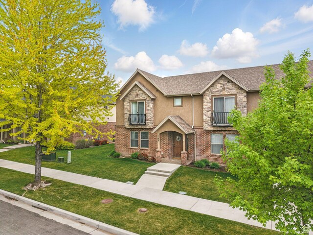 783 W 175 S, Springville, UT 84663 - view of front of property featuring a front lawn, stucco siding, stone siding, and a shingled roof