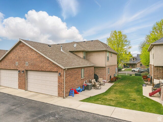 783 W 175 S, Springville, UT 84663 - view of property exterior with a shingled roof, brick siding, a yard, central air condition unit, and a patio area