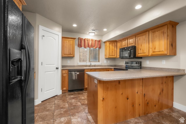 783 W 175 S, Springville, UT 84663 - kitchen with black appliances, a peninsula, baseboards, light countertops, and a sink