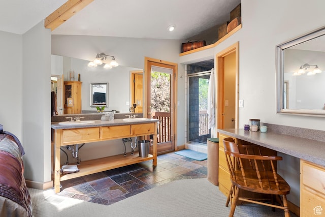 2456 E Bonneville Ter, South Ogden, UT 84403 - full bathroom with stone tile floors, a stall shower, lofted ceiling, double vanity, and baseboards