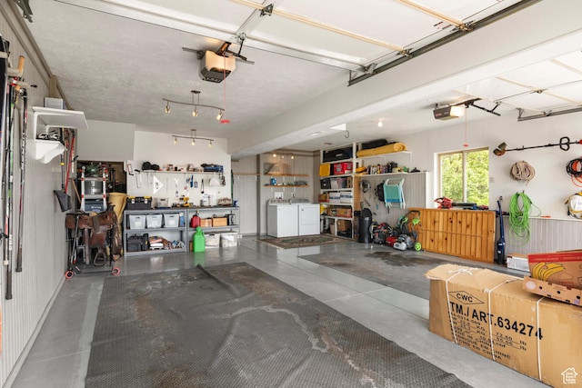 2456 E Bonneville Ter, South Ogden, UT 84403 - garage featuring independent washer and dryer, a garage door opener, and a workshop area