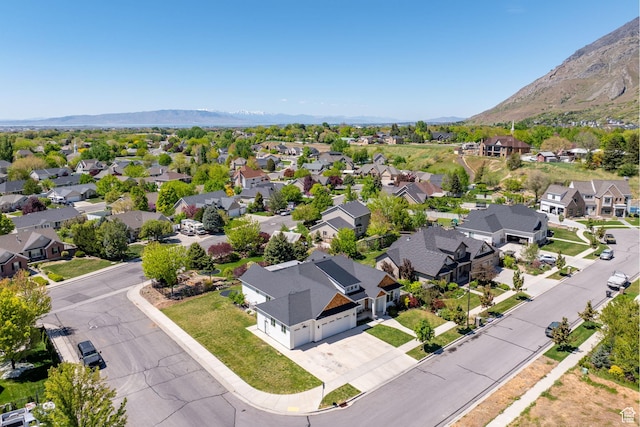 aerial perspective of suburban area with a mountainous background