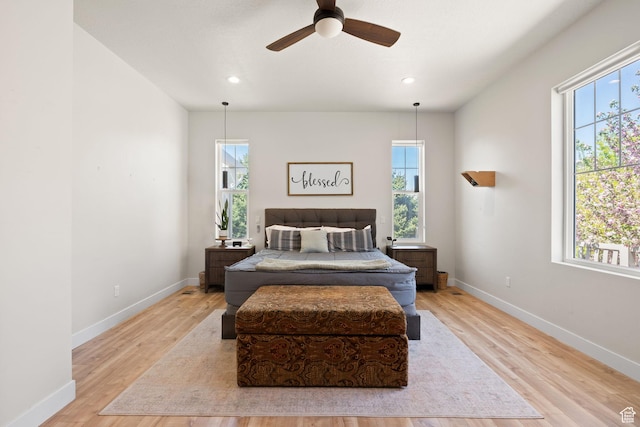 bedroom with wood finished floors, baseboards, recessed lighting, and ceiling fan
