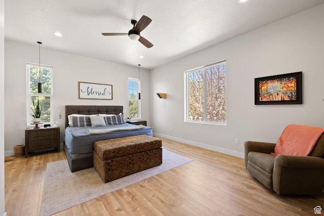 bedroom with light wood-style floors, baseboards, recessed lighting, and ceiling fan