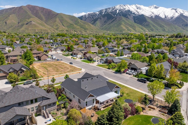 aerial view of residential area featuring mountains