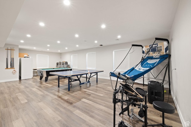 game room with baseboards, recessed lighting, and light wood-type flooring