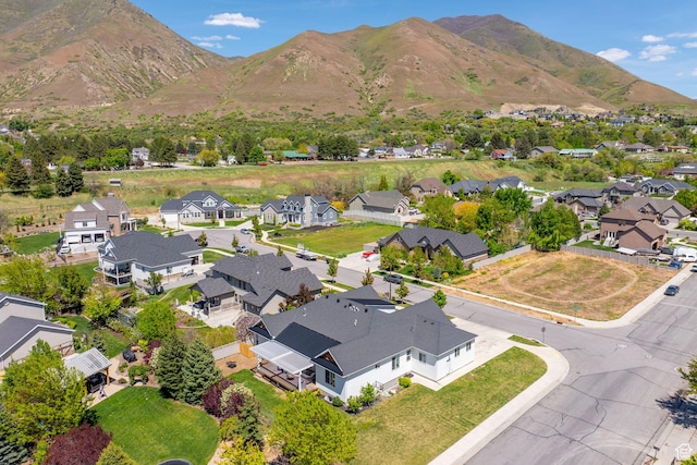 aerial view of residential area featuring a mountain backdrop