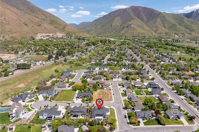 aerial view of property's location with mountains and nearby suburban area