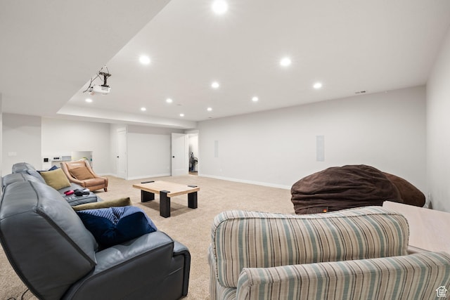 living area with light carpet, recessed lighting, and baseboards