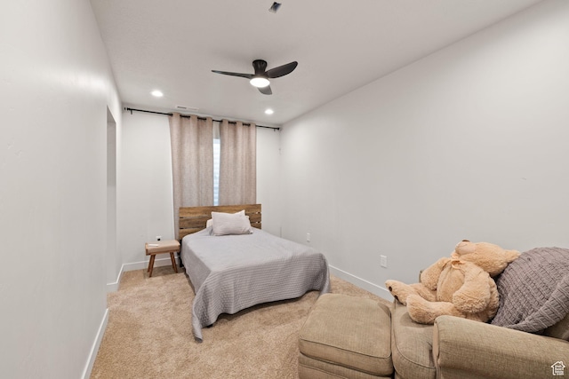 bedroom with baseboards, recessed lighting, light carpet, and ceiling fan