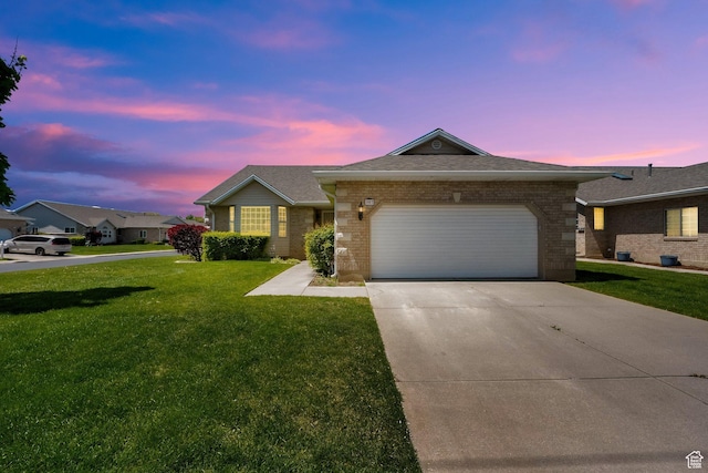 ranch-style house with brick siding, a front yard, a garage, driveway, and a shingled roof