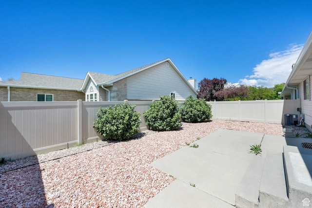 view of patio featuring cooling unit and a fenced backyard