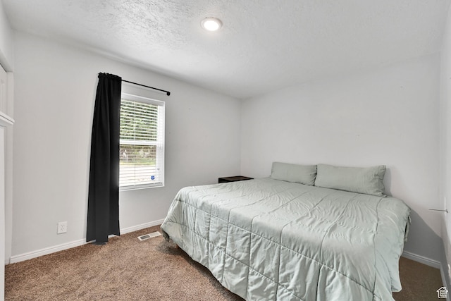 256 13th St, Ogden, UT 84404 - bedroom with carpet floors, baseboards, and a textured ceiling