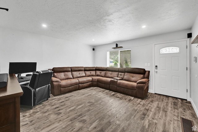 256 13th St, Ogden, UT 84404 - living area with a textured ceiling, wood finished floors, and recessed lighting