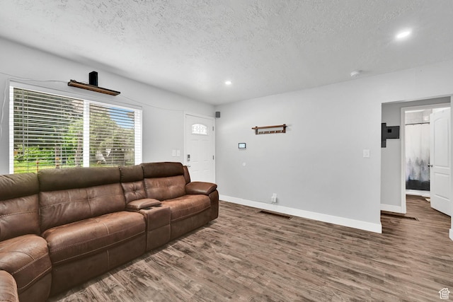 256 13th St, Ogden, UT 84404 - living room with a textured ceiling, wood finished floors, recessed lighting, and baseboards