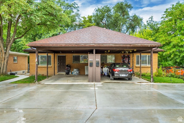 3400 S 2000 E, Millcreek, UT 84109 - view of front of property with driveway, brick siding, and a shingled roof