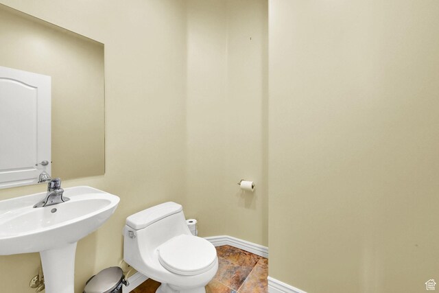 337 S 300 E, Willard, UT 84340 - bathroom with toilet, baseboards, a sink, and stone finish floors