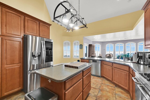 337 S 300 E, Willard, UT 84340 - kitchen with stainless steel appliances, a sink, brown cabinetry, and dark countertops