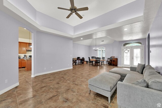 337 S 300 E, Willard, UT 84340 - living room featuring a ceiling fan, a chandelier, baseboards, french doors, and arched walkways