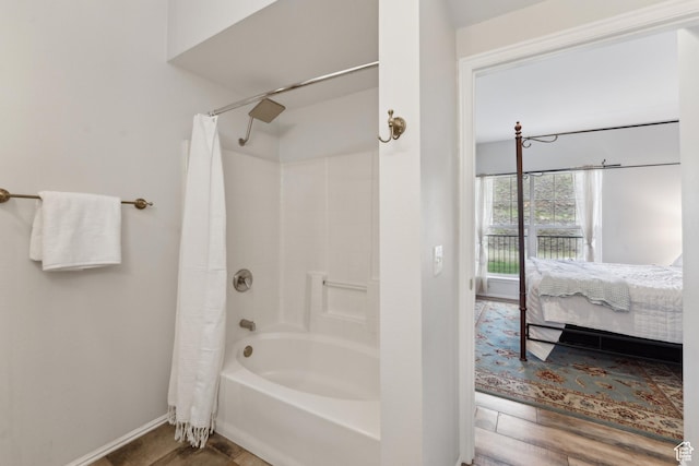 900 Bitner Rd Unit D11, Park City, UT 84098 - bathroom with ensuite bath, baseboards, wood finished floors, and shower / bath combo with shower curtain