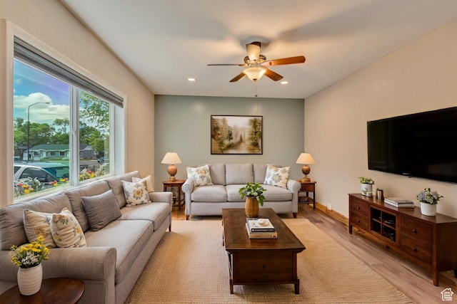living area with ceiling fan, light wood-style floors, and recessed lighting