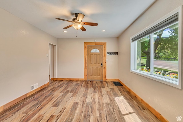 foyer entrance with light wood finished floors, baseboards, ceiling fan, and recessed lighting