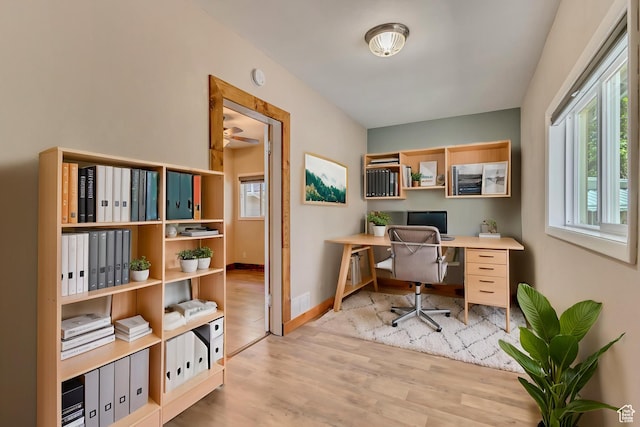 office space featuring wood finished floors and baseboards