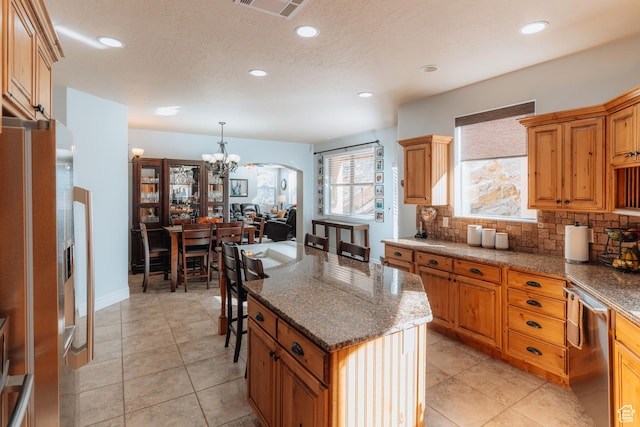 1866 N Matchstick Way, Cedar City, UT 84721 - kitchen featuring stainless steel appliances, a chandelier, decorative backsplash, arched walkways, and recessed lighting