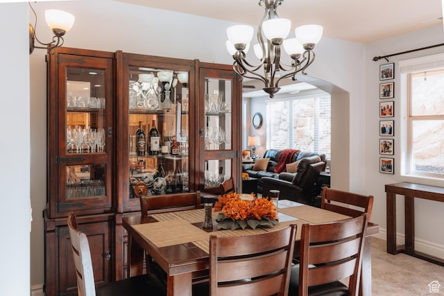 1866 N Matchstick Way, Cedar City, UT 84721 - dining room featuring a chandelier, arched walkways, and baseboards