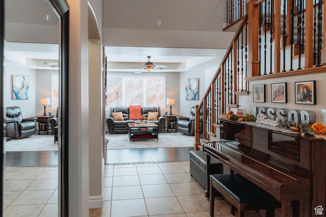 1866 N Matchstick Way, Cedar City, UT 84721 - corridor featuring a tray ceiling, light tile patterned floors, stairway, and arched walkways