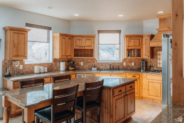 1866 N Matchstick Way, Cedar City, UT 84721 - kitchen with a sink, tasteful backsplash, appliances with stainless steel finishes, a kitchen bar, and a kitchen island