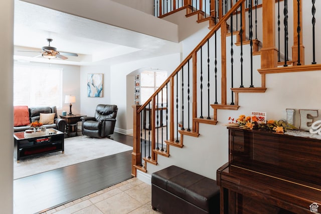 1866 N Matchstick Way, Cedar City, UT 84721 - stairway featuring arched walkways, ceiling fan, baseboards, and a raised ceiling
