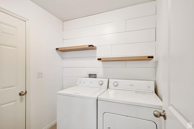 laundry area with independent washer and dryer