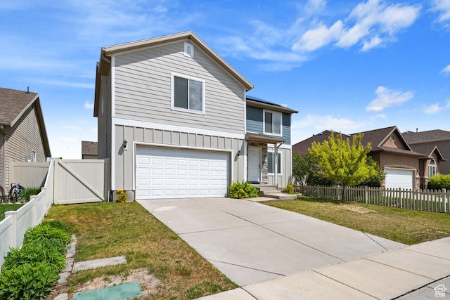 traditional home with board and batten siding, an attached garage, driveway, and a gate