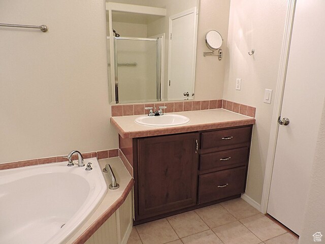 681 E Sunset St, Delta, UT 84624 - full bath featuring tile patterned floors, a shower stall, vanity, and a bath