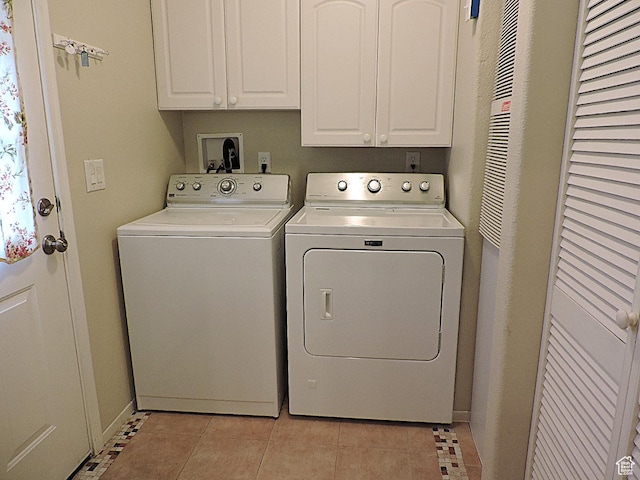 681 E Sunset St, Delta, UT 84624 - laundry area featuring separate washer and dryer, cabinet space, and light tile patterned flooring
