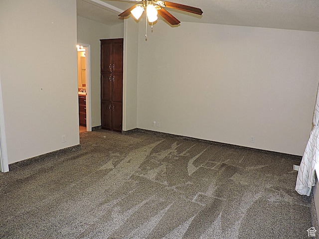 681 E Sunset St, Delta, UT 84624 - empty room with dark colored carpet, a ceiling fan, and baseboards