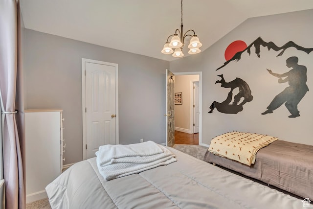 bedroom featuring a chandelier, baseboards, lofted ceiling, and carpet floors