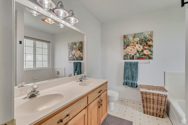 full bath with a tub, toilet, double vanity, and tile patterned floors
