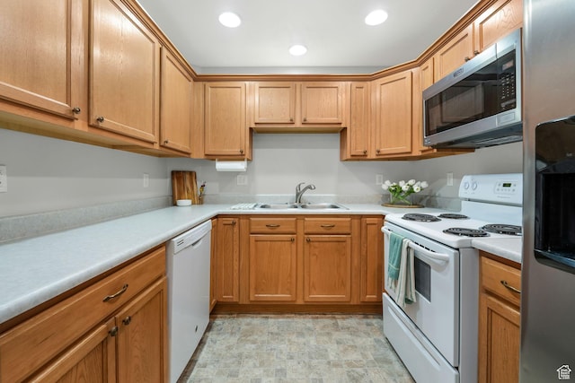 1693 W Westbury Unit D, Lehi, UT 84043 - kitchen with white appliances, a sink, light countertops, stone finish floors, and recessed lighting