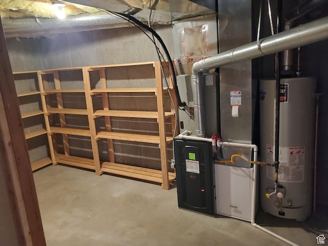 utility room with water heater and heating unit